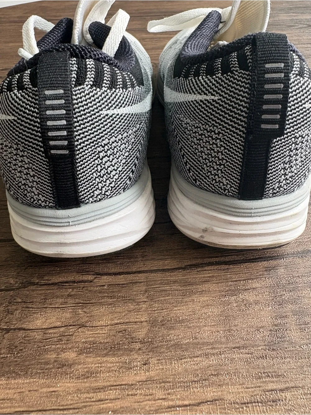 Nike Women’s White and Black Flyknit Sneakers - Picture 5 of 7